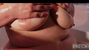 busty bbw wife oils up her huge tits for fun 😏