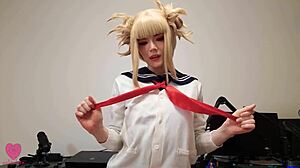 Himiko Toga from My Hero Academia in cosplay uniform enjoying a playful scene with riding and licking
