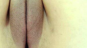 Teen flaunts her peachy shaved pussy for the camera