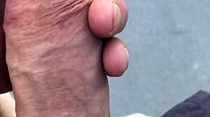 Mature woman exposes big tits on hot day