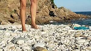 naked latina inserts pebbles on public beach!