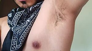 Young man strips naked and cums very hot with armpit and boots