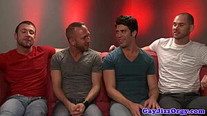 Rex Roddick passionately sucks with four muscular pals on sofa.