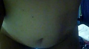 Young Couple Stands for Intimate Moment at Home