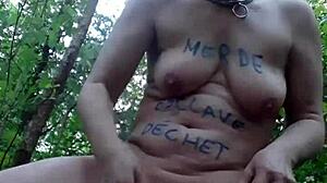 Female Slave Endures Intense BDSM In Forest.