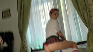 Tiny thong under her skirt reveals the stunning beauty's legs in this romantic solo scene.