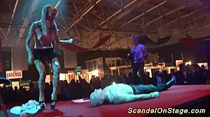 Scandalous Performance On Public Stage With Flexible Moves And Props