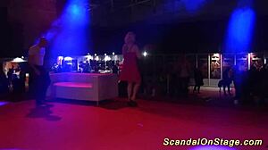 Scandalous Performance On Public Stage With Flexible Moves And Props