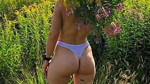 Anna Mole walks in nature with small tits in short shorts