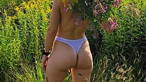 Anna Mole walks in nature with small tits in short shorts