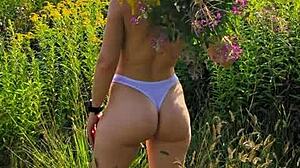 Anna Mole walks in nature with small tits in short shorts