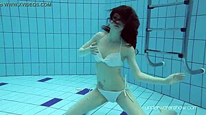 Roxalana Cheh shows off her sexy redhead body underwater, all shaved and ready.