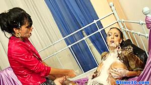 Glam lesbians strapon fuck while cum covered