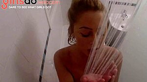 Adorable blonde teen gets horny in the shower, showing off her huge boobs on webcam