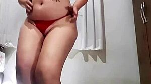 Look at this naughty slut smoking and stripping!