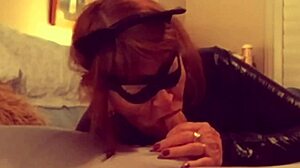 Hey, check out Catgranny blowing Batman in costume! 😺🦇