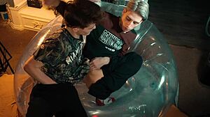 Two sweet guys share an inflatable chair