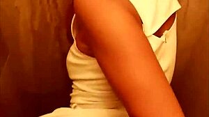 Couple caught in intimate moment in public restroom.