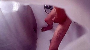 Hidden camera catches roommate pounding ass with a plunger in wild anal action.