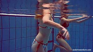 Marusia and Melisa Darkova dive into fierce underwater lesbian action.