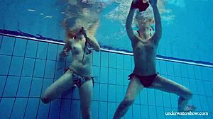 Marusia and Melisa Darkova dive into fierce underwater lesbian action.