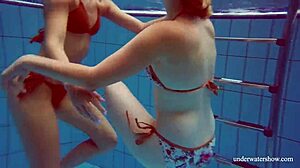 Marusia and Melisa Darkova dive into fierce underwater lesbian action.