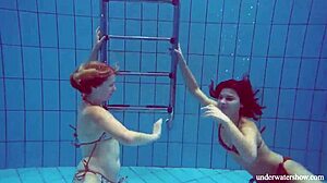 Marusia and Melisa Darkova dive into fierce underwater lesbian action.