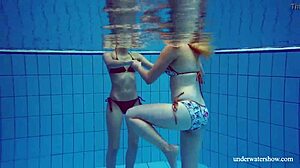 Marusia and Melisa Darkova dive into fierce underwater lesbian action.