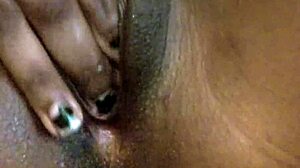 Skinny ebony MILF indulges in wet solo play