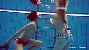 Marusia and Melisa Darkova dive into fierce underwater lesbian action.