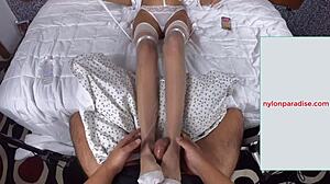 adriana lima gives hot footjob in white stockings and cum on nylon soles
