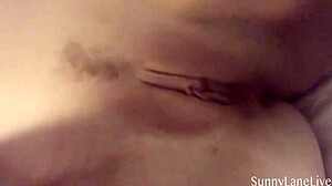 sunny lane poses in lingerie, rubbing her big clit shaved pussy