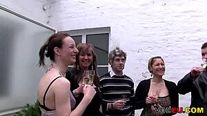 German gangbang featuring multiple men in hardcore group sex with licking, bending over, and orgy activities.