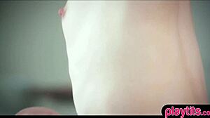 A real redhead teen engages in passionate lesbian sex with a brunette, exploring each other's bodies.