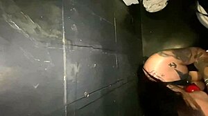 Tattooed wife sucks cock in party bathroom