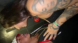 Tattooed wife sucks cock in party bathroom