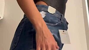 Wife Heyya changes clothes in shopping dressing room.