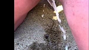 my wife takes long pee on african beach