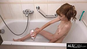 Slim teen 18+ teases gaping pussy with vibrator to orgasm in tub