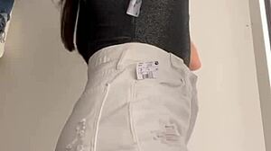 Wife Heyya changes clothes in shopping dressing room.