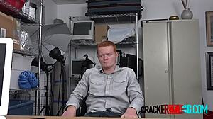 Gay redhead feels excited taking the director's big black cock for cash in the office