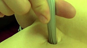 Fifi Foxx playing with belly button casually