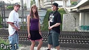 she's in the public street getting banged in a group orgy.