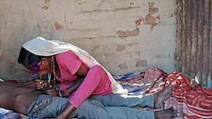 Desi wife in pink skirt bent over for rough action. Did she enjoy the cold drink before?