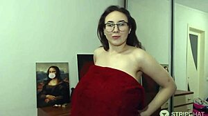 i'm a brunette camgirl with glasses oiling up my huge tits