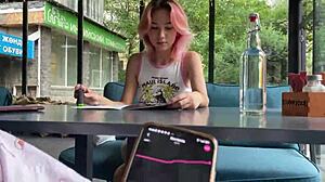 skinny girl walks city with vibrator inside