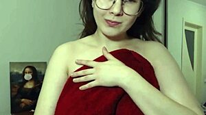 i'm a brunette camgirl with glasses oiling up my huge tits