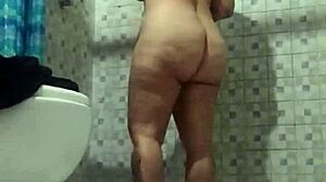 Latina mature stepmother spied in bathroom shower.