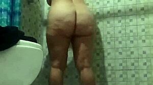 Latina mature stepmother spied in bathroom shower.