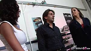 two mature women interact with two workers in the garage